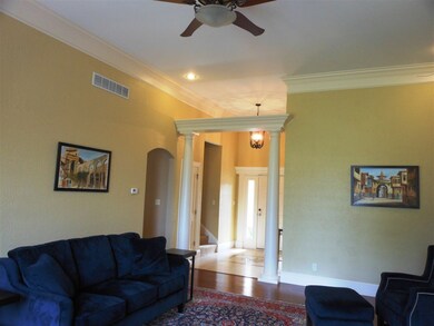A comfortable room with beautiful hardwood floorin