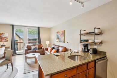Kitchen featuring stainless steel dishwasher, a si