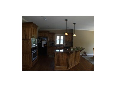 Kitchen with built-in appliances and large pantry