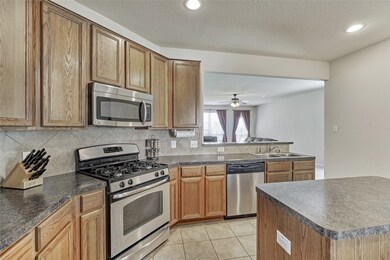 There are lots of 42 inch oak cabinets in the kitchen allowing for lots of storage space!