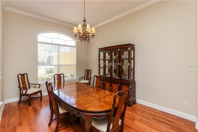 Formal dining room features high ceilings, crown m