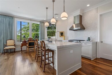 Chef's kitchen with top of the line appliances and upgraded marble countertops