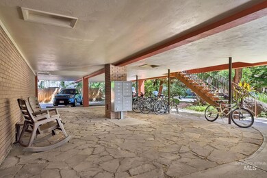 View of patio with mail area and stairs