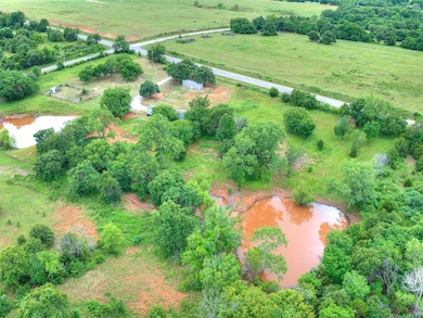 Aerial view of sparsely populated area featuring a nearby body of water