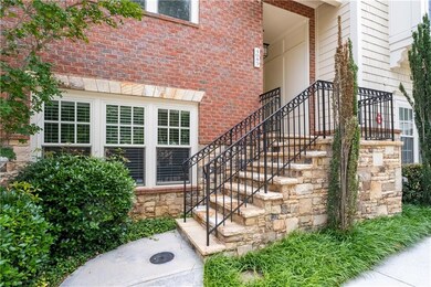 Doorway to property with brick siding and stone siding