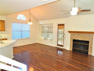 Unfurnished living room featuring dark wood-type 