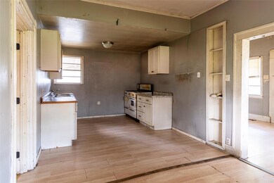 Kitchen featuring range with two ovens, light hard