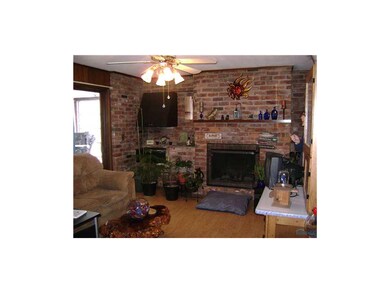 Den. Wood burning fireplace and well-vented indoor