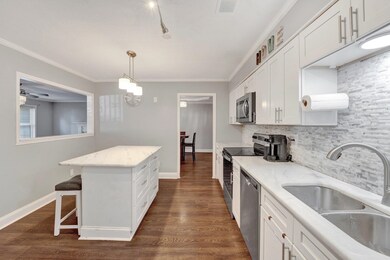 Kitchen featuring stainless steel appliances, whit