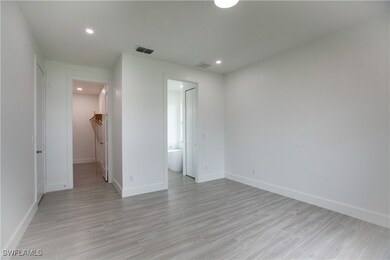 Spare room with light wood-style floors and recess