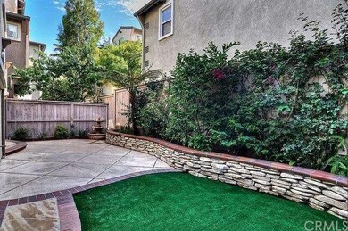 CHARMING REAR YARD WITH CUSTOM HARDSCAPE AND FOUNT