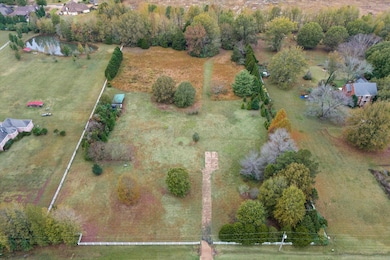 Birds eye view of property with a rural view and a