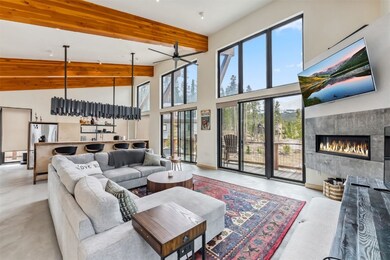Living area featuring high vaulted ceiling, a tile