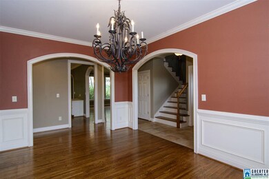 Beautiful arched doorways lead to Foyer and the Ha