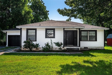 Bungalow-style home featuring crawl space, a front lawn, an attached garage, and a shingled roof
