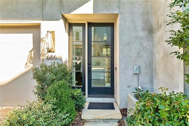 Entrance to property featuring stucco siding