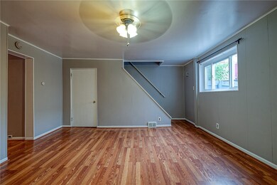 DININGROOM FACING STAIRS AND DOOR TO BASEMENT.  APPROX. 15'X14'
