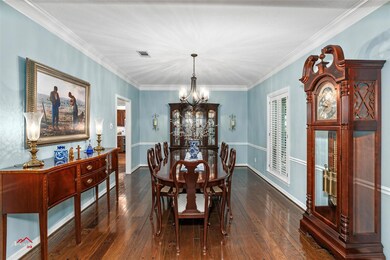 Dining space with dark wood-type flooring, ornamen
