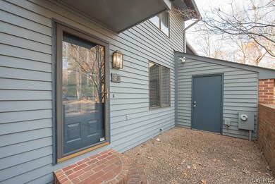 Lockable storage room houses garbage cans, wall mo