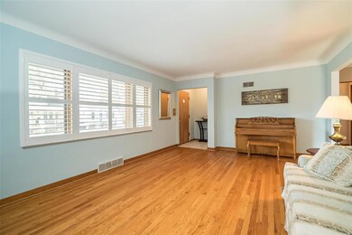 Formal living room and foyer with Plantation Shutters