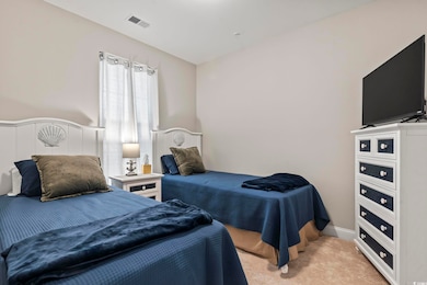 Bedroom with light carpet