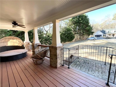 Deck with a porch and ceiling fan