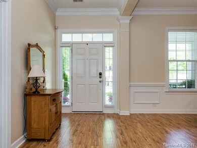 entry greet you with high ceilings & gleaming floo