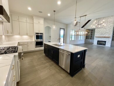 THIS KITCHEN is amazing. Storage is key! Opens to all entertaining areas! Walk in pantry/ Organizers desk/ and large island.