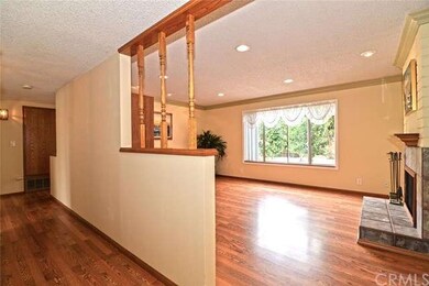 Open Living Room with upgraded wood laminated floo