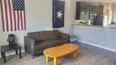 Living area featuring light wood finished floors a
