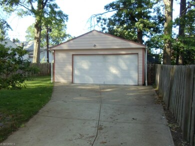 LARGE TWO CAR GARAGE AND ROOM FOR ALL YOUR TOOLS.
