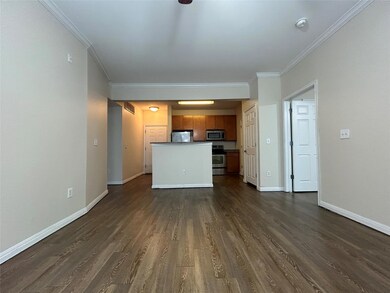 Unfurnished living room featuring dark wood finis