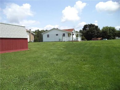 Exterior Front. beautiful level yard and shed