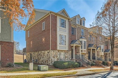 View of front of home with stone siding and brick 