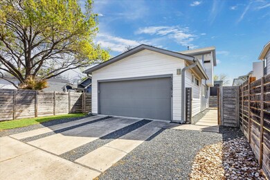 Garage featuring fence