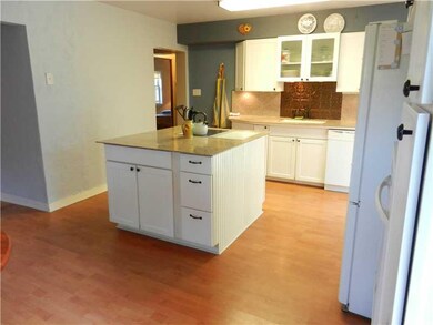 Kitchen. Laminate floors are tough and maintenance