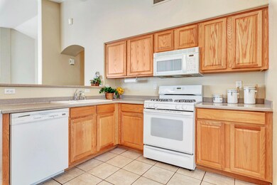 Kitchen has view to living room