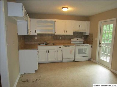 KITCHEN WITH NEW FLOORING AND FRESH PAINT