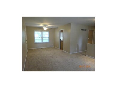 Living room has brand new carpet, paint, ceiling f