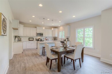 White Cabinets Galore in this Beautiful Kitchen.