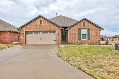 View of front facade featuring a garage and a fron