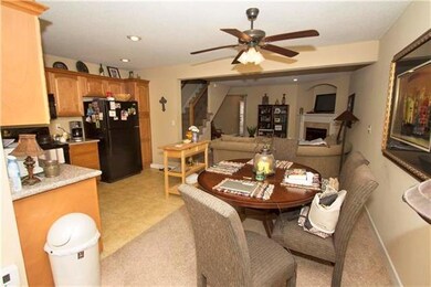 The living room is open to the fully-equipped eat-