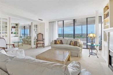Living room with light carpet and ceiling fan