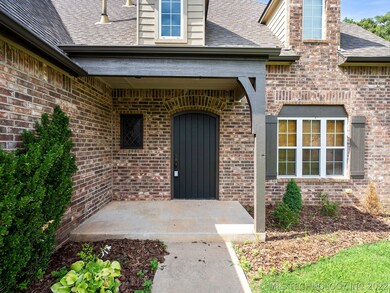 Covered porch on this tudor style home!