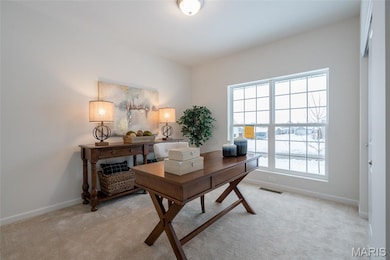 Office area with carpet floors and baseboards