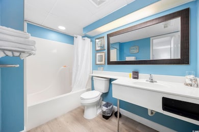 Full bathroom with vanity, toilet, shower / tub co