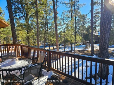 Front deck tall pines view