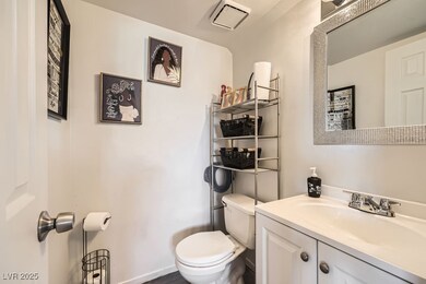 Bathroom with visible vents, vanity, and toilet
