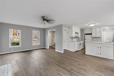 ANOTHER FAMILY ROOM VIEW WITH WINDOWS LOOKING OUT