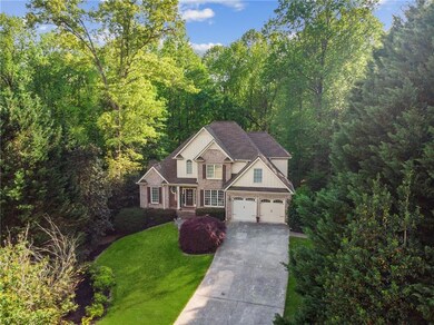 Traditional-style home featuring a front lawn, dri